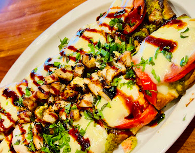 Sun Singer Restaurant signature dishes Sun Burger
Sea Scallops Fettuccine
Margherita Flatbread
